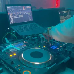 A close-up of my hands on the Pioneer DJ controller during a live set. I use top-tier equipment to seamlessly mix a wide variety of genres, from Bollywood and Punjabi to international hits and Kannada favorites.