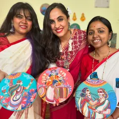Our team proudly holding the completed Durga Pujo wall plate set. We love dressing up and getting into the festive spirit while creating these special pieces.