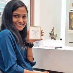Holding up a freshly penned note for a happy customer. My goal at any live event is to create these small moments of joy and a unique, tangible memory for every guest.