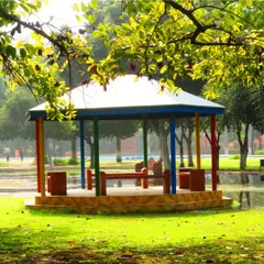 A colorful gazebo in Leisure Valley Park, Gurgaon, a public project we worked on. The structure provides a simple, cheerful shelter for park visitors, surrounded by green lawns and trees.
