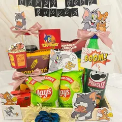 A snack hamper perfect for your buddy who is always 'bhukkad' (hungry). This Tom & Jerry themed crate is filled with chips, popcorn, and drinks for a fun and nostalgic movie night.