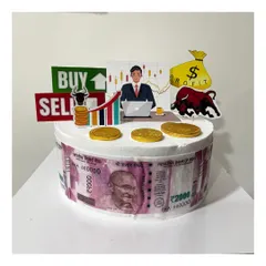 A custom half-kg Ferrero Rocher cake for a stock trader. The cake is decorated with edible money prints and toppers representing the stock market bull and "Buy/Sell" signs.