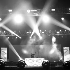 A wide shot of my stage setup for an IIT campus show. The professional lighting rig and massive LED screen show the scale of production I bring to college events.