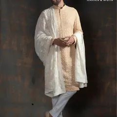 A masterpiece for Rakhi or any family celebration. This Ivory Shadow Kurta features intricate tone-on-tone hand embroidery, offering a look of elevated minimalism and quiet luxury.