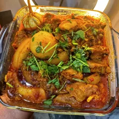 My Manipuri pork curry is a customer favorite. It's cooked until tender with potatoes in a rich, aromatic gravy and garnished with fresh coriander for that authentic home-cooked flavor.