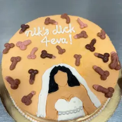 This bachelorette cake definitely brought some laughs to the bakery. Featuring a bride-to-be and a shower of edible decorations, it's a perfect example of the fun, custom, and naughty cakes I love to make for your special celebrations.