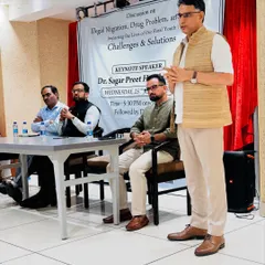 Listening intently as the keynote speaker addresses the pressing issues faced by our youth. These forums bring together people from all walks of life to work towards a common goal.