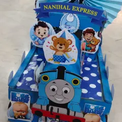 A close-up of the 'Nanihal Express' engine, featuring Thomas the Tank Engine and Boss Baby cutouts. I customize these themes based on what the client wants.