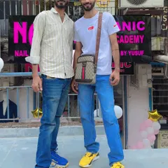 Standing outside my academy. I started this to help people like you turn their passion for nails into a successful career.
