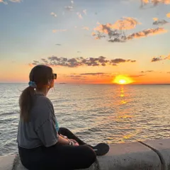Taking a moment to just sit and watch the waves and the beautiful colors of the sunset. These simple moments of connection with nature are what wellness is all about.