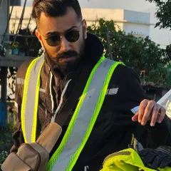 Geared up and ready to ride. This portrait shows my look for adventure shoots, suitable for modeling motorcycle gear, outerwear, and accessories like sunglasses.