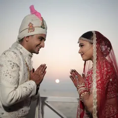 A serene wedding ceremony with the sunset over the ocean as the backdrop. Planning a wedding on a ferry involves unique logistical challenges, all of which we handle seamlessly.