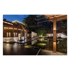 The KLE Centenary Museum at dusk, where restored heritage architecture meets new landscape interventions. The interplay of light, water, and structure creates a serene public plaza, transforming a historic site into a vibrant urban space.