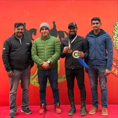 Our coach stands with a silver medalist from the CCN Introductory Eventing. Our experienced coaches are the cornerstone of our riders' success.