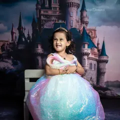 Sparkles, giggles, meet the queen of cuteness. Her expression is priceless in this fairytale setting.