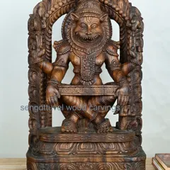 A powerful 26-inch sculpture of Lord Narasimha, the fierce lion avatar of Vishnu. This piece is carved from Vaagai wood and captures the intensity and divine strength of the deity.