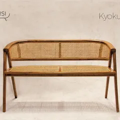 The 'Kyokusen' bench, a beautiful and functional piece for an entryway or living area. The seat and back are fully woven with rattan, set in a solid teak frame.
