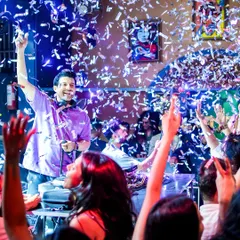 The crowd's energy is everything. Here I am, feeding off the vibe during a packed ladies' night at Happy Brew, with confetti raining down.