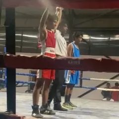 The moment of victory for our young boxer, Scott. Having his hand raised is a reward for the discipline and countless hours of training.