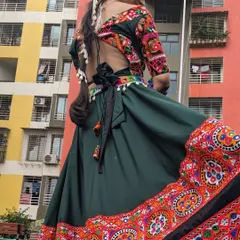 A full view of my green garba night lehenga. The vibrant embroidery and wide flare are perfect for dancing all night. I offer full sets on rent, including jewellery.