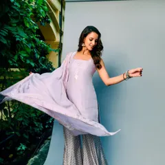 A playful moment captured during the shoot. The lilac color is so soft and pretty, and the outfit moves beautifully.