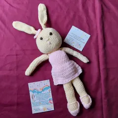 A lovely and large amigurumi rabbit doll, complete with a pink dress and shoes. This was a custom order for a child's gift.