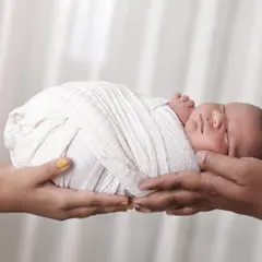 A powerful and emotional shot, capturing the love and protection of new parents. We believe these parent-and-baby portraits are some of the most important keepsakes from a newborn session.