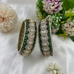 A still image of the 'Sitara' green kundan bangles.