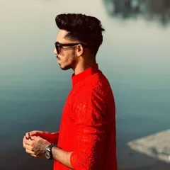 A side profile showing the fit and style of the red Chikankari kurta. It's a versatile piece that looks great for both casual gatherings and more formal events.