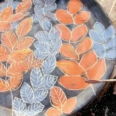 The sgraffito process in action. I am carefully carving the veins of the leaves, a delicate process that requires a steady hand.