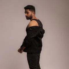 A dynamic pose looking over the shoulder, creating a sense of intrigue. This is a great example of a branding shot that conveys attitude and personality.