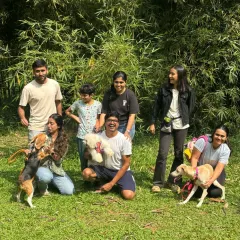 A successful socialization session is not about a chaotic free-for-all. Here, we are practicing engagement with parents and calm neutrality in the presence of other dogs, which are the foundational skills for good social behavior.