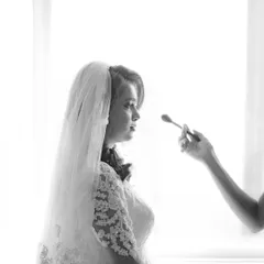 A quiet moment during the getting-ready process for my bride, Irene. This black and white shot captures the artistry and focus that goes into creating the perfect bridal look.