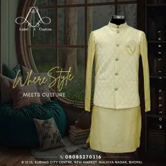 This image showcases a complete kurta and Bandi set in a soft yellow. The jacket has a delicate woven pattern and a small chain accessory, demonstrating how small details can elevate the entire outfit. This is a perfect look for a daytime wedding function or festive celebration.