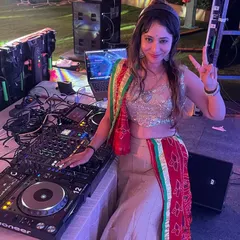 Behind my professional Pioneer setup at an outdoor Garba night. I'm ready to get the party started with a mix of traditional and modern dance music.