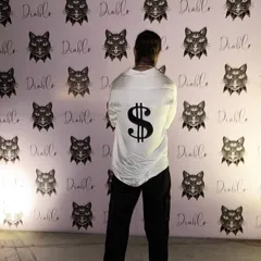 The back view of the custom white shirt, showcasing a bold, black dollar sign motif. This is a great example of how I can incorporate personal symbols or unique designs into a classic piece of menswear.