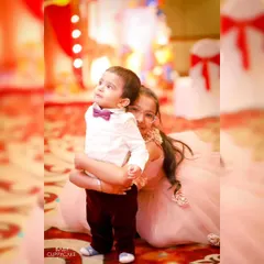 A sweet hug between a big sister and her little brother. These are the precious, unscripted moments we are always looking for during a family event.