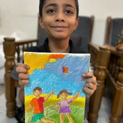 An older student's detailed Makar Sankranti drawing, showing children flying kites. This piece captures the festive spirit and is a great example of memory drawing.