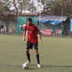 As head coach, I'm seen here on the field during the Republic Cup Finals. My role is to guide and motivate the players through every moment of a high-pressure game.