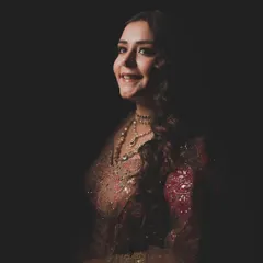 A portrait of a bride, glowing with happiness. This shot captures the essence of what we aim for: a look so perfectly you, it feels like a second skin. The right outfit and styling bring out that inner confidence.