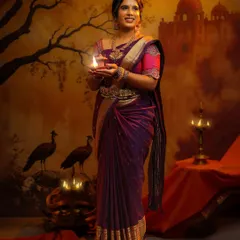 A beautiful concept shoot for my lovely client, Anjana. The theme was inspired by classic paintings, and I created a traditional look with a deep purple saree, temple jewelry, and a glowing lamp to set the mood.