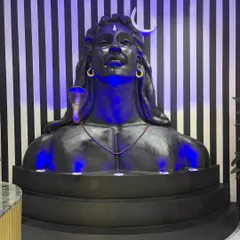 The Shiv mural fully installed and illuminated with custom blue lighting. This view shows how the sculpture commands the space and sets a devotional, inspiring tone.