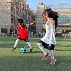 A moment of pure joy and playful competition on the pitch. Our sessions for young girls and boys encourage active play and healthy interaction in a supervised setting.