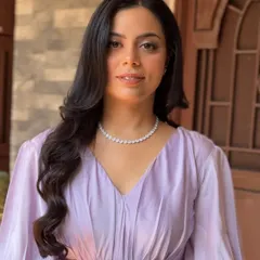 The same makeup look, now in direct natural light. The skin looks radiant and the highlighter provides a natural-looking glow, not a glittery stripe.