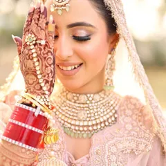 That happy bride glow. It's the best feeling to see my work become a part of such a special day. This bride's intricate henna beautifully complements her jewellery and smile.