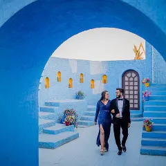Walking through a stunning blue archway, Yash and Priyanshi look like they are in their own private Santorini. The vibrant blue color creates a striking and memorable pre-wedding photograph.