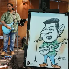 Here is the finished caricature of a talented musician, drawn live during his performance at a Sunday brunch. I enjoy capturing the passion of fellow artists in my work.