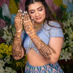 Here is a beautiful bride on her special day, showing how my intricate henna design complements her modern lehenga. The full-sleeve mehendi adds a layer of tradition and elegance to her overall look.
