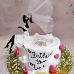 Another take on a bride-to-be cake, this time with a delicate net veil and baby's breath. The ruffle skirt detail is one of my favorite things to create.
