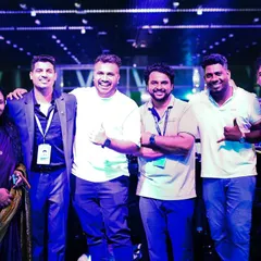 Posing with the event management team and fellow artists after a successful corporate show. Strong collaboration ensures a smooth and stress-free event for the client.